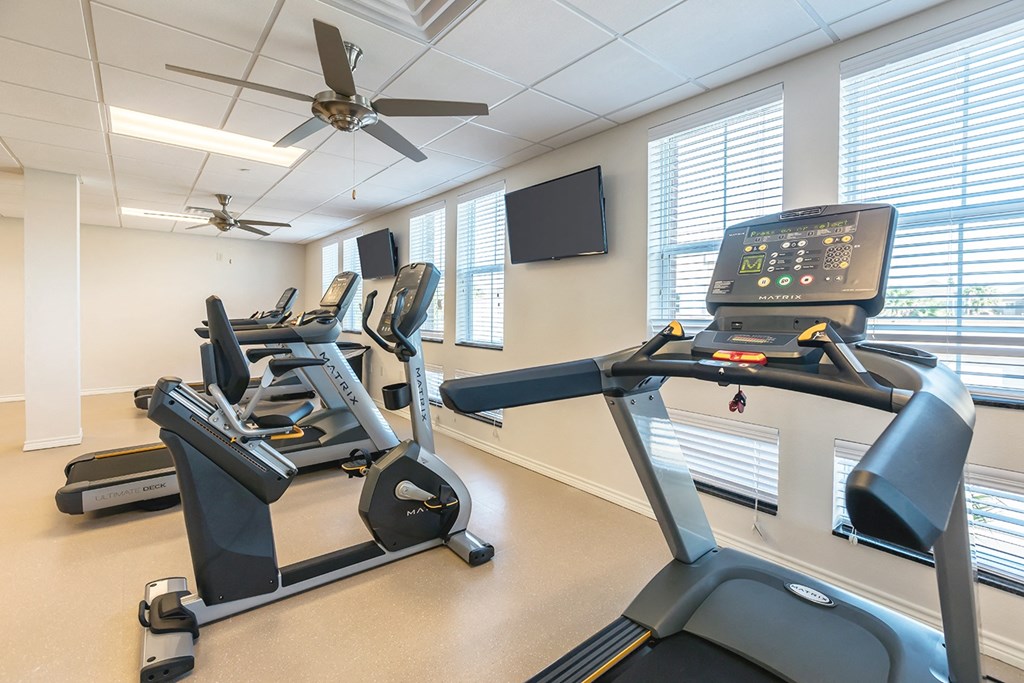 gym with exercise equipment at the district at highland village apartments