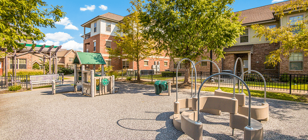 West Park Apartments playground with green roofs and playthings