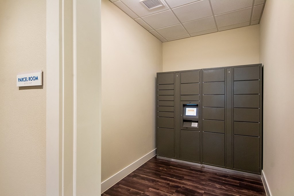 a set of lockers in a room with a wooden floor