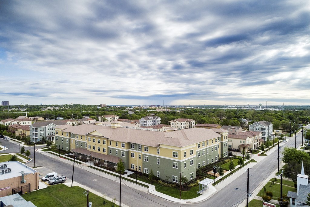an aerial view of apartment buildings on a city street