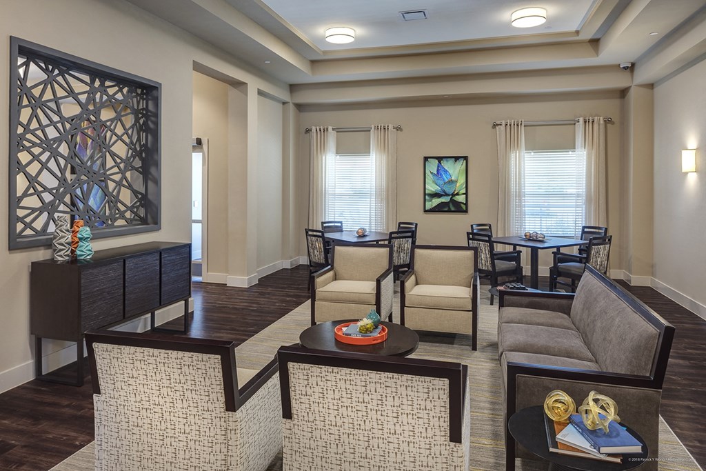 a living room with couches and chairs and a table