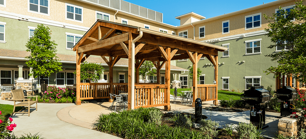 a pavilion in the middle of Wheatley Park Senior Living Apartments