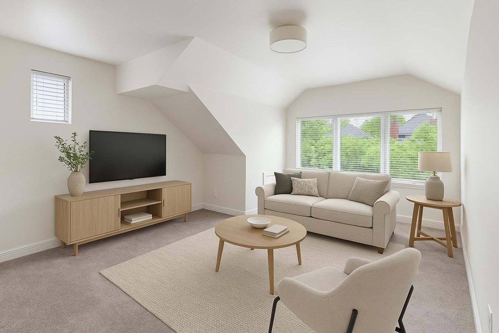 A living room with a television, sofa, and coffee table.