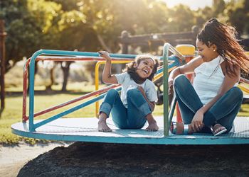 Mom and daughter on merry go round