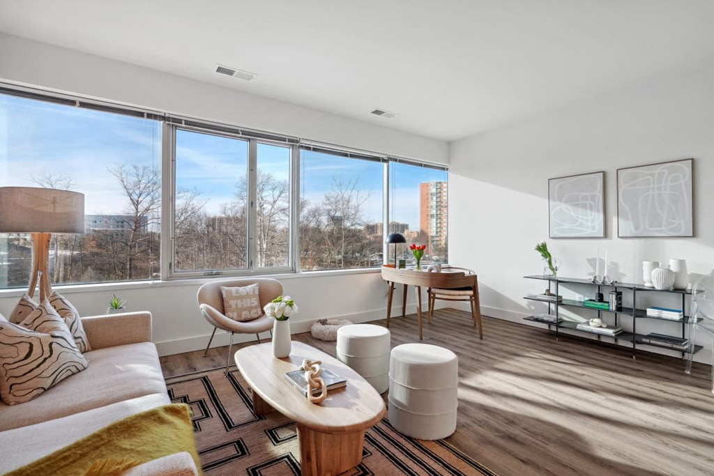 a living room with a large window and a couch at Sinclaire on Seminary, Virginia