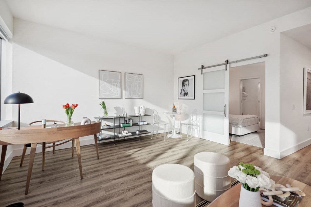 a living room and dining room with a table and chairs at Sinclaire on Seminary, Virginia