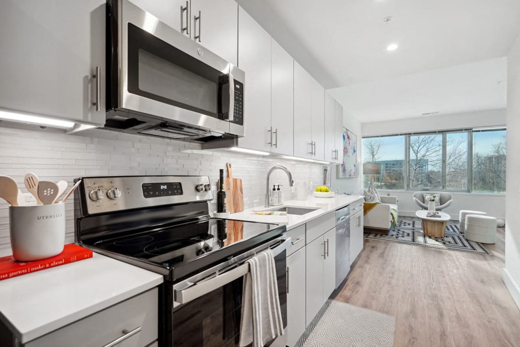 a kitchen with a stove and a microwave at Sinclaire on Seminary, Virginia