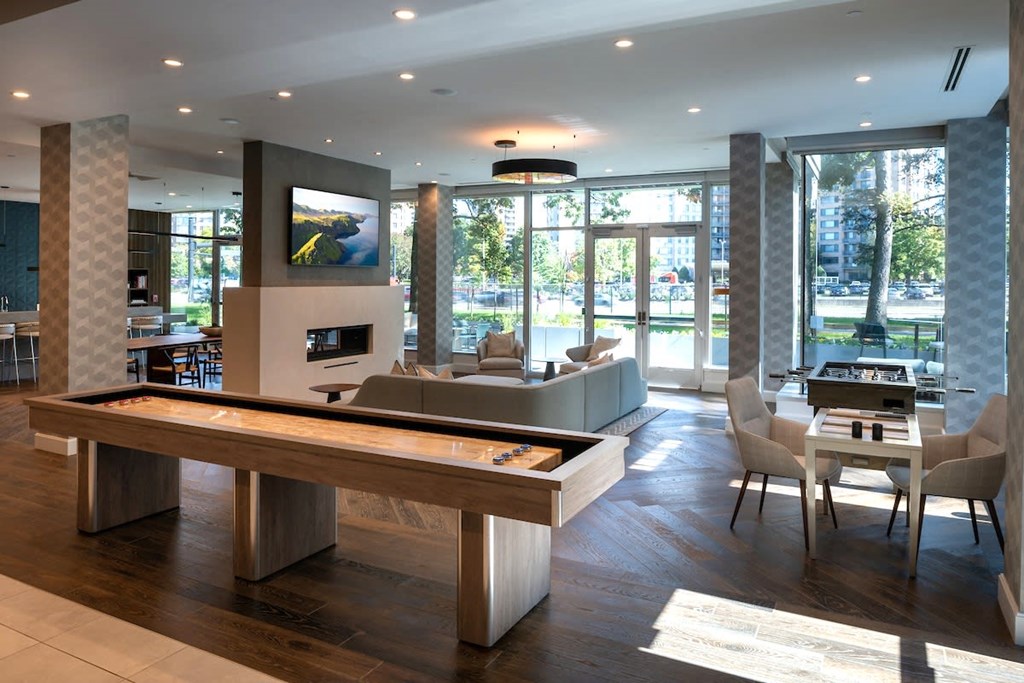 a living room with a pool table and a dining room at Sinclaire on Seminary, Alexandria