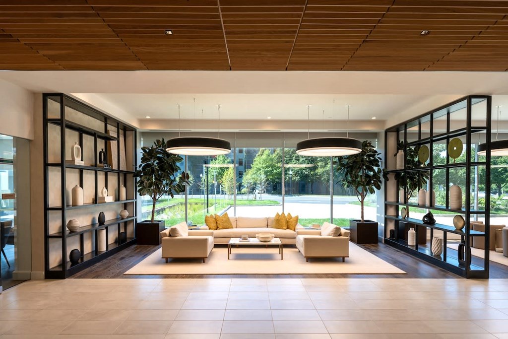 a large living room with a couch and a table at Sinclaire on Seminary, Alexandria, VA