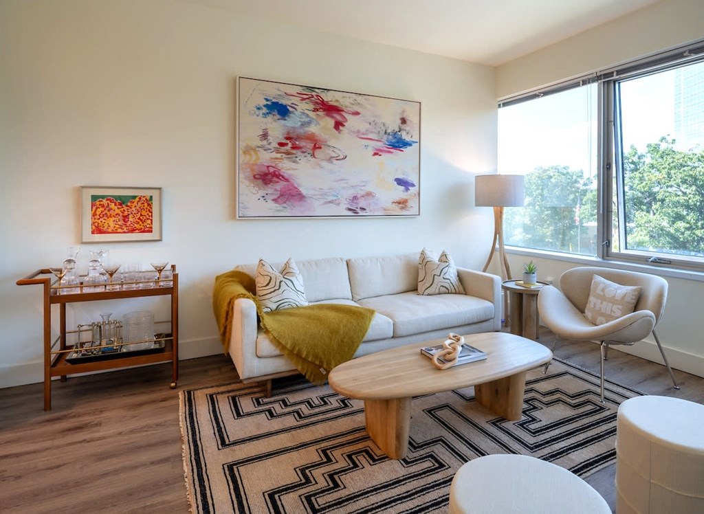 a living room with a couch and a table at Sinclaire on Seminary, Virginia