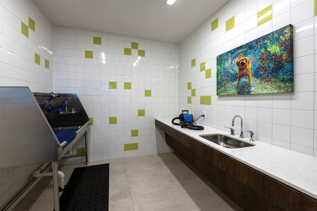 a kitchen with a sink and a painting on the wall at Sinclaire on Seminary, Virginia, 22311