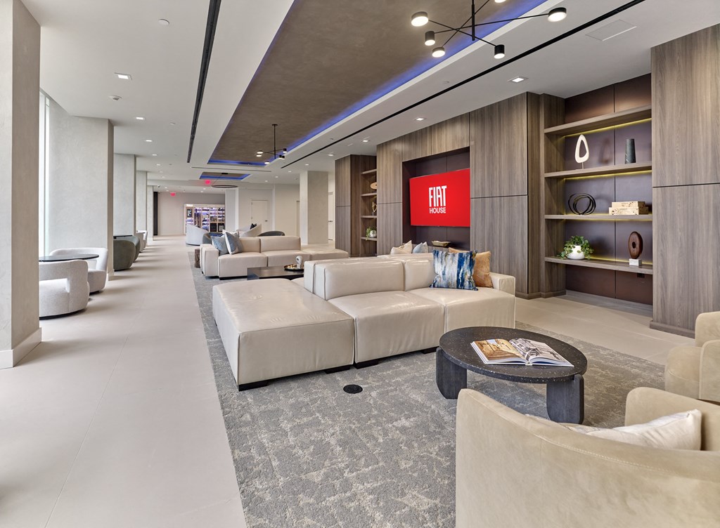 a lobby with couches and chairs and a coffee table
