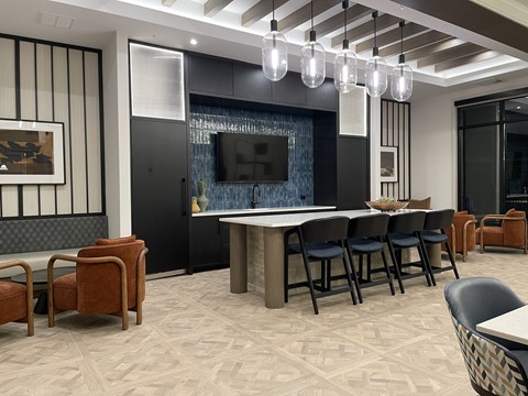 A modern living room with a television and comfortable seating.