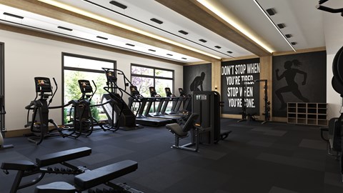 A gym with a motivational poster on the wall.