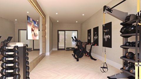 A gym with exercise equipment and a mirror on the wall.