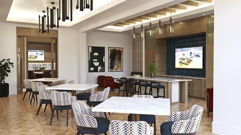 A room with a long table and chairs.