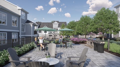 A patio with a table and chairs is surrounded by greenery.