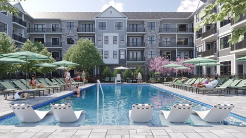 A large pool surrounded by lounge chairs and umbrellas in front of a multi-story apartment building.