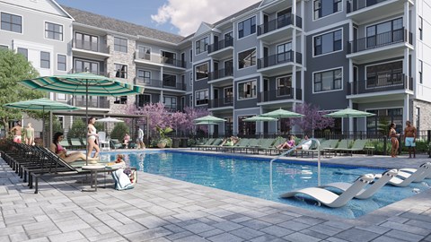 A swimming pool surrounded by lounge chairs and umbrellas in front of apartment buildings.