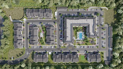 A bird's eye view of a residential complex with a swimming pool.