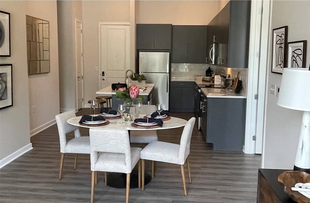a kitchen and dining area in a 555 waverly unit