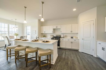 Kitchen and dining room with island and recess lighting - Photo Gallery 3