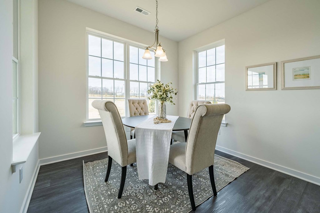 Dining area with large windows and natural sunlight