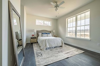 Primary bedroom with large windows and tons of natural light - Photo Gallery 5
