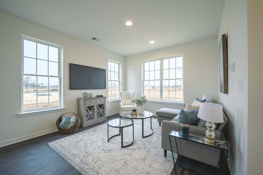 Living room with large windows and natural night