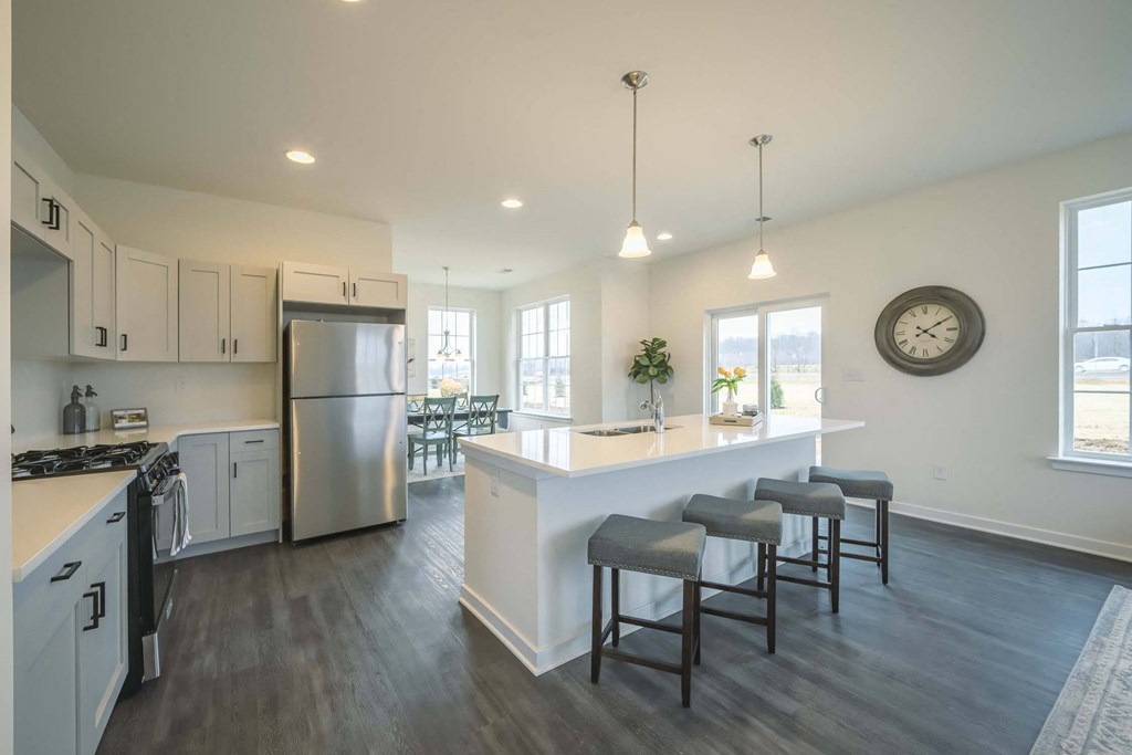 Kitchen with stove, refrigerator and island