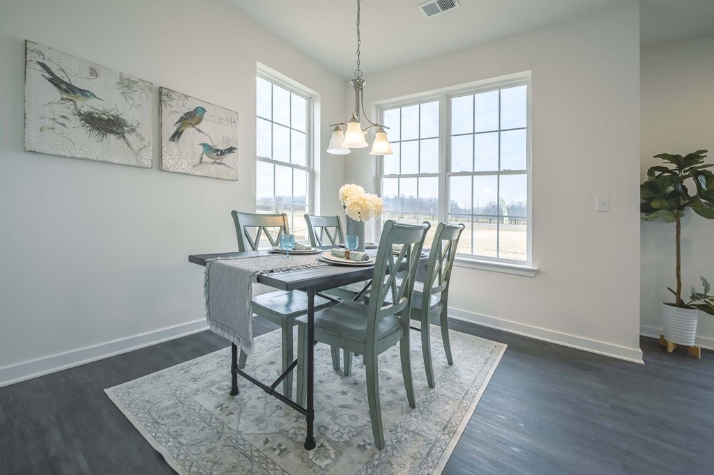 Dining area with large windows and natural sunlight