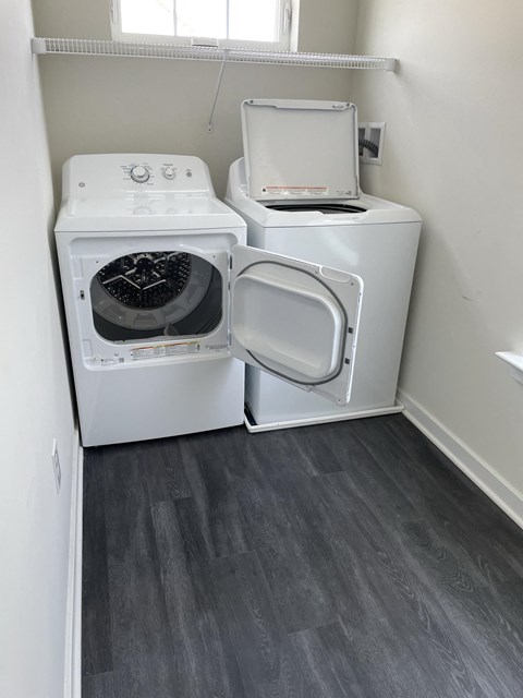 a washer and dryer in a room with a window