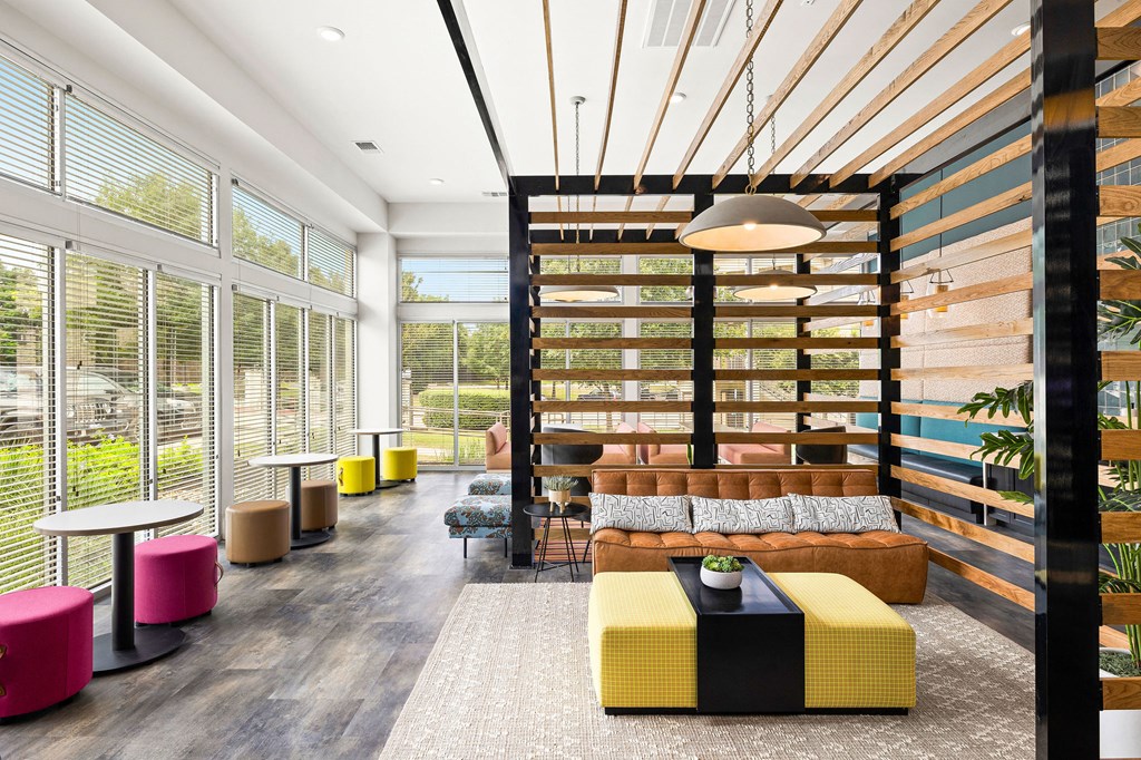 a lounge area with a couch and tables