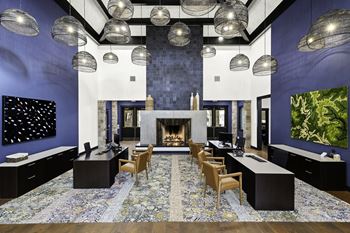 a conference room with blue walls and a fireplace