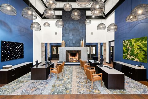 a large conference room with blue walls and a fireplace