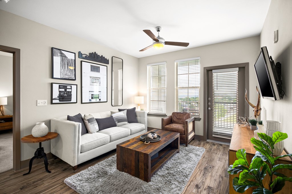 a living room with a white couch and a coffee table