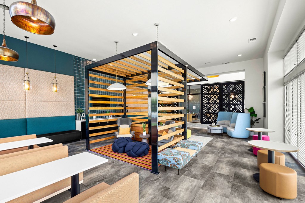 a living room with a wooden divider