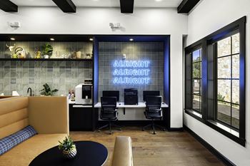 an office with a desk with chairs and a sign that says allabor allabor