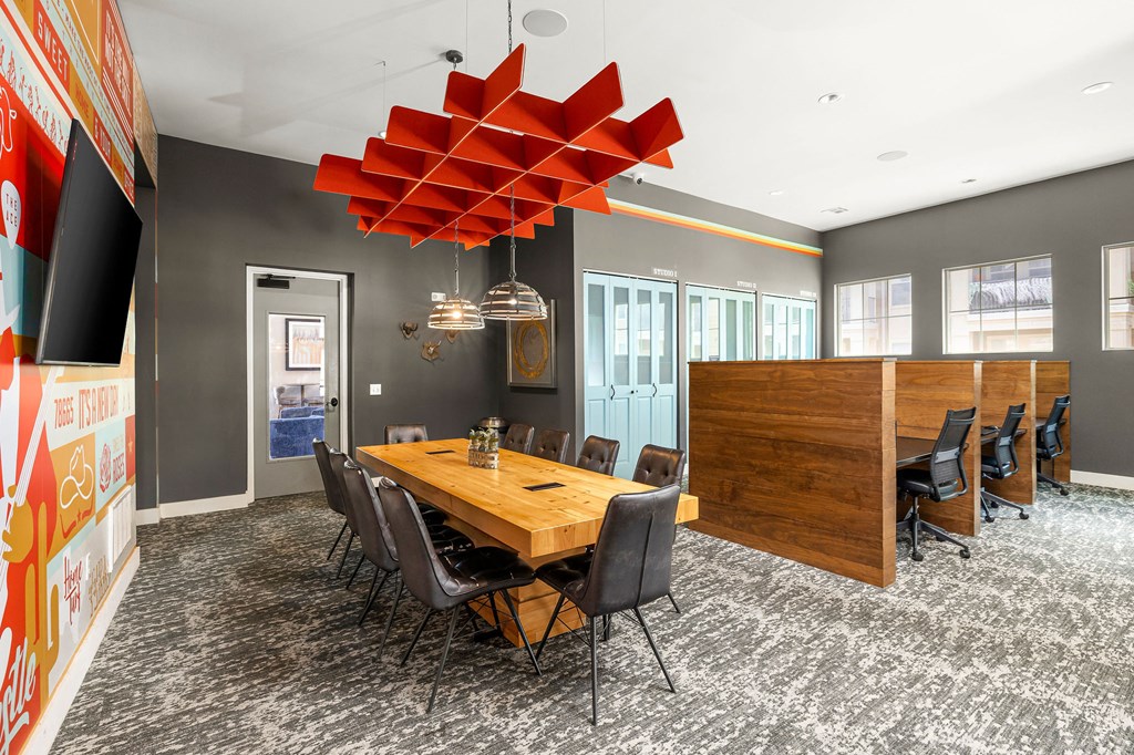 a conference room with a wooden table and chairs