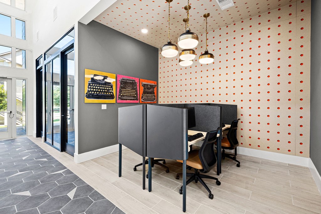 a dining area with a table and chairs in a room with a door