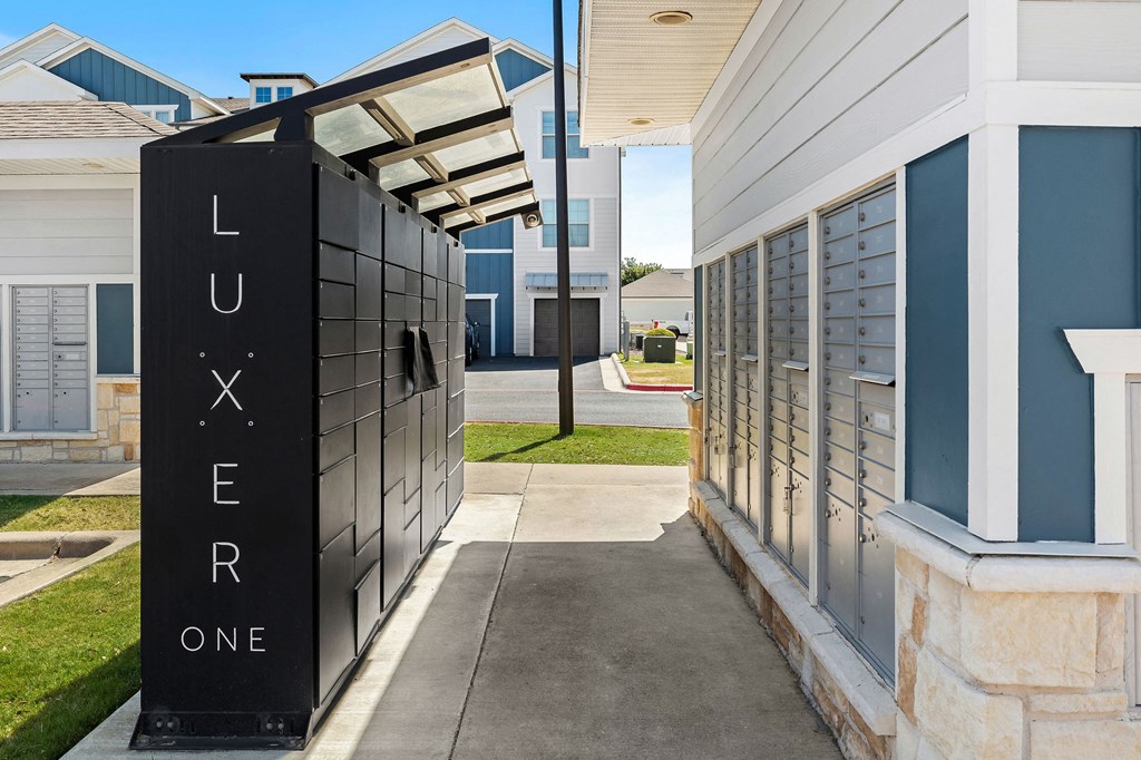 a package locker next to a building at bexley at tech ridge.