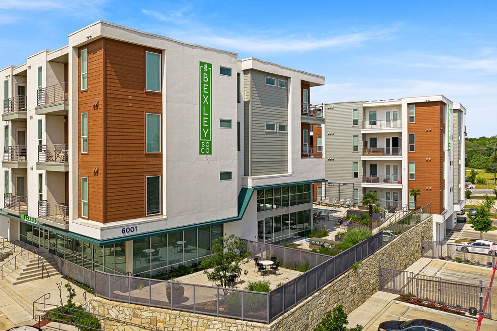 a building with a green sign on the side of it