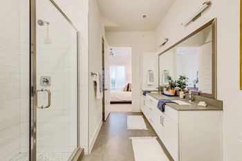 a small bathroom with a shower and a sink