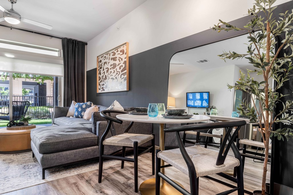 a living room with a table and a couch and a tv