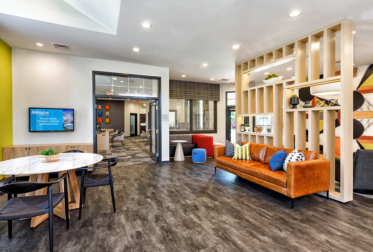 a living room with a couch and a table