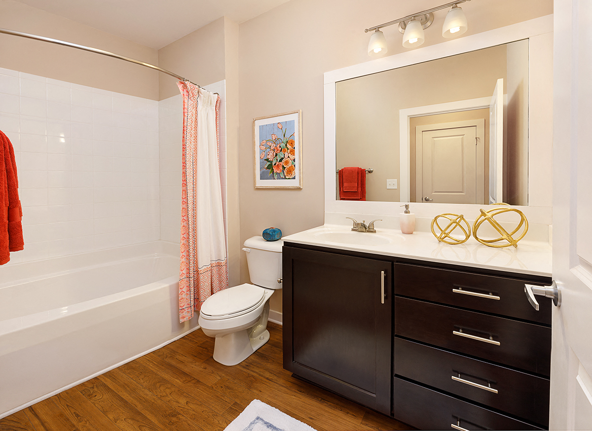 a bathroom with a shower toilet and sink