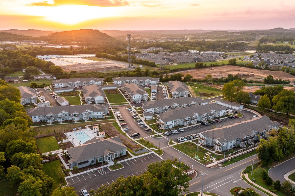 an aerial view of a group of houses in a parking lot
