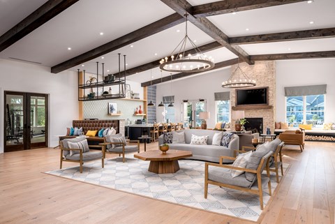 A modern living room with wooden floors and furniture.