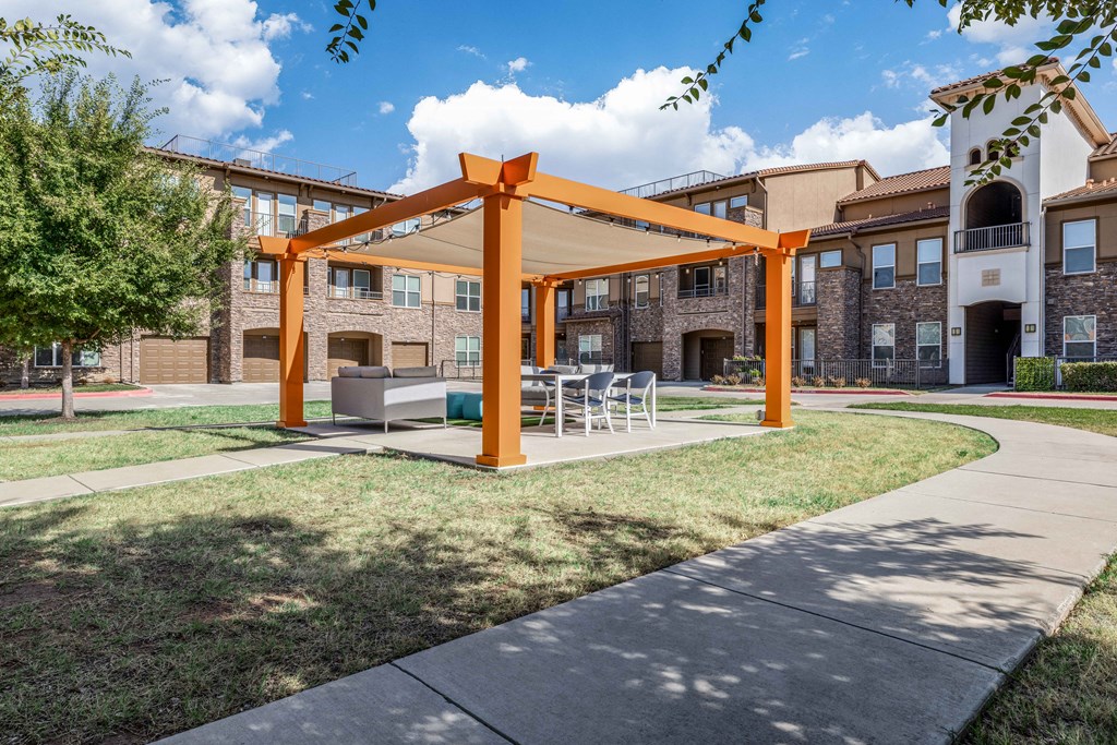 our apartments offer a patio with a table and chairs