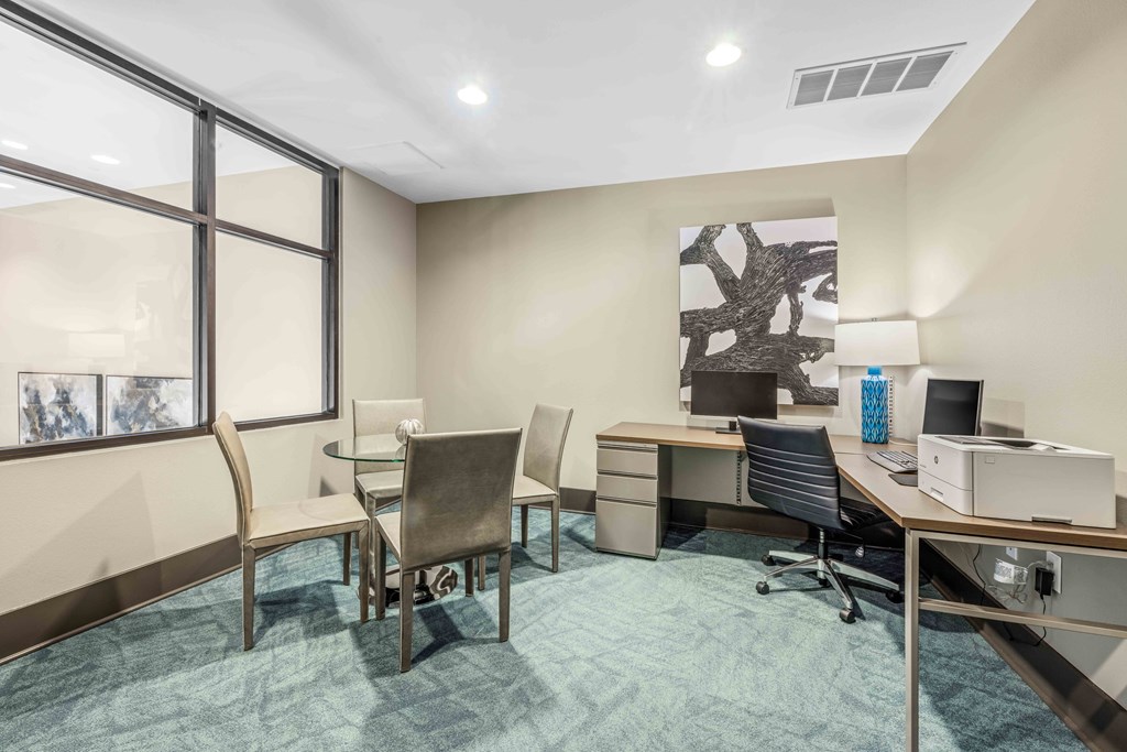 a room filled with furniture and a large window